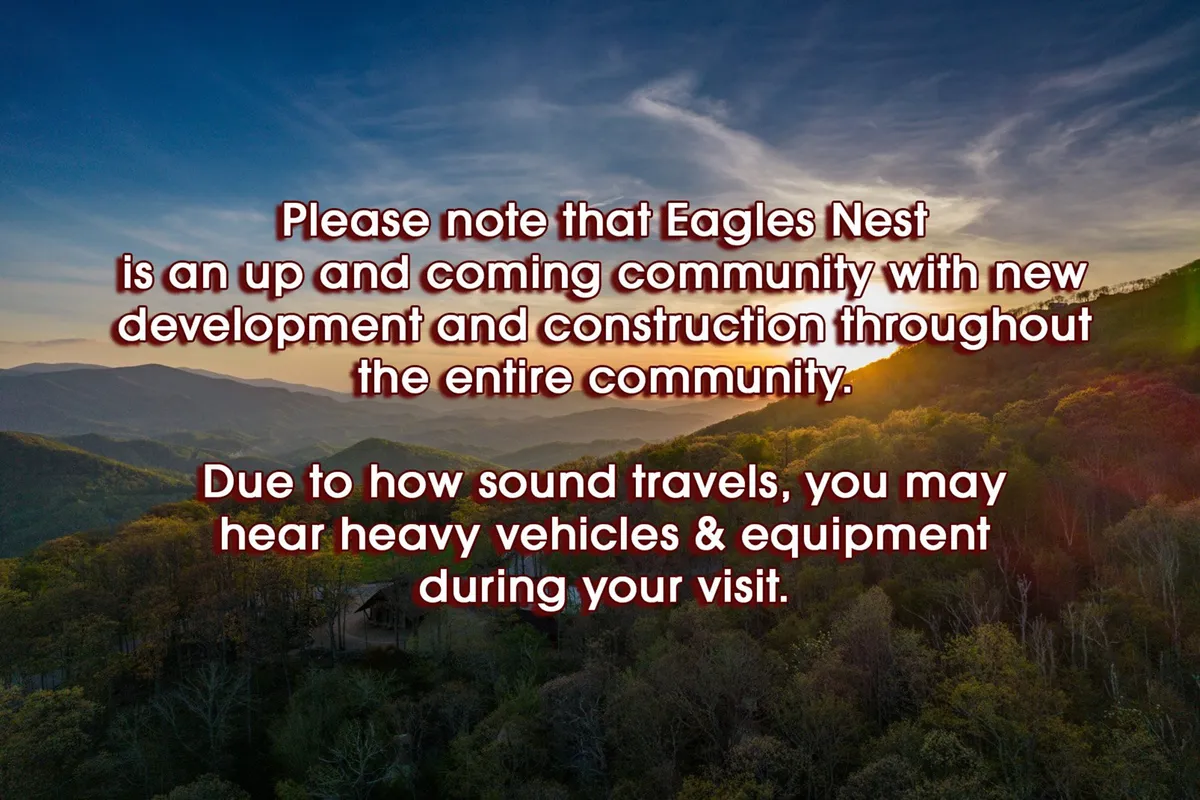 A panoramic mountain range beneath a glowing sunset sky, surrounded by lush greenery. The open setting suggests opportunities for hiking, nature walks, and community gatherings against a stunning natural backdrop.